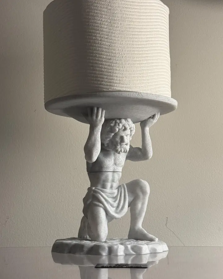 Marble-finish Atlas figure kneeling to hold a paper roll above his shoulders