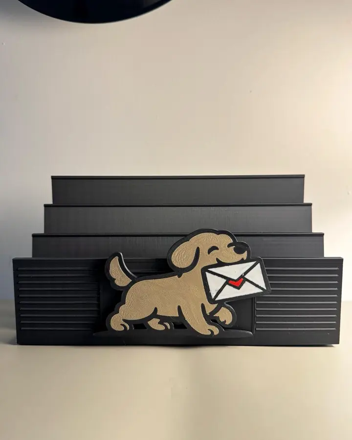 Black slotted mail organizer with a golden retriever carrying an envelope, holding letters